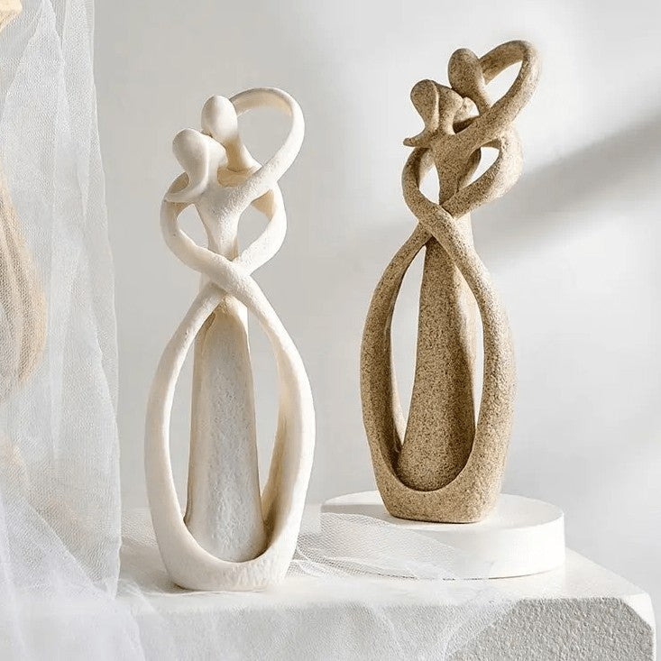 Abstract resin sculpture of two embracing figures - product photo 1