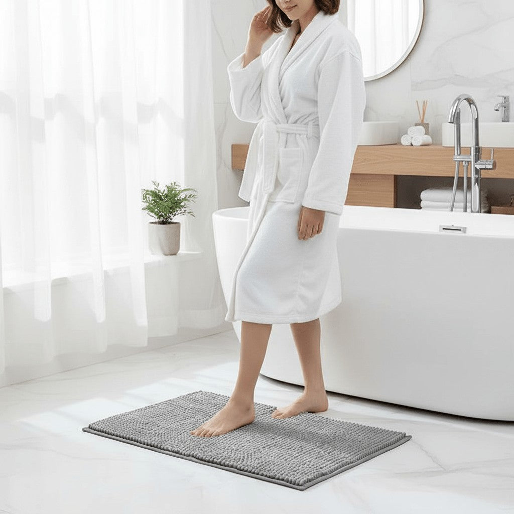 Chenille bath mat with a non-slip backing on a bathroom floor - product photo 2