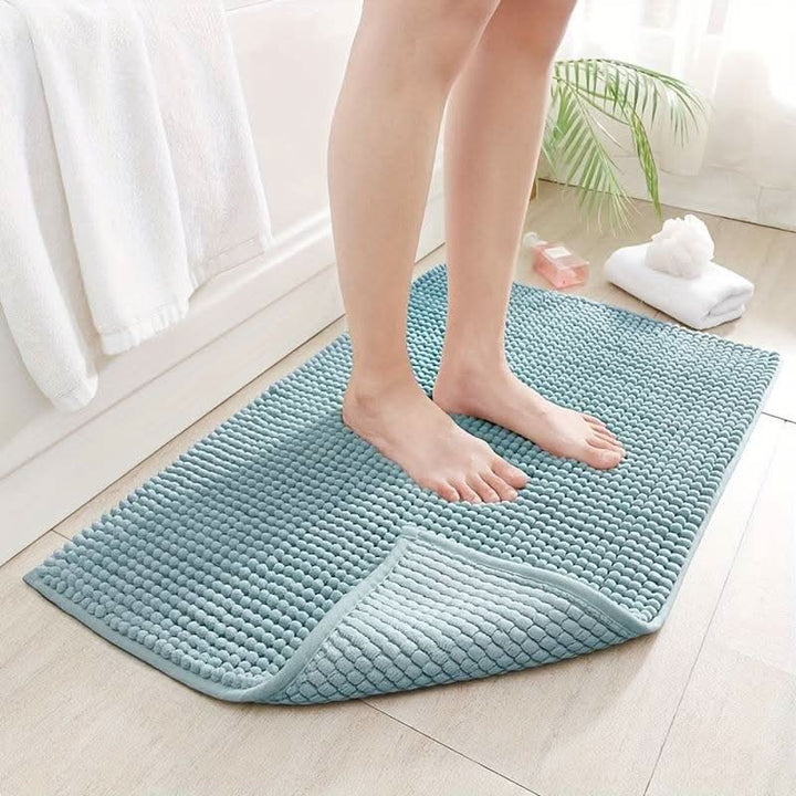 Chenille bath mat with a non-slip backing on a bathroom floor - product photo 3