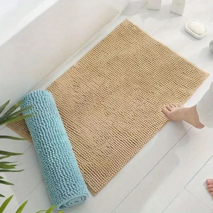 Chenille bath mat with a non-slip backing on a bathroom floor - product photo 4