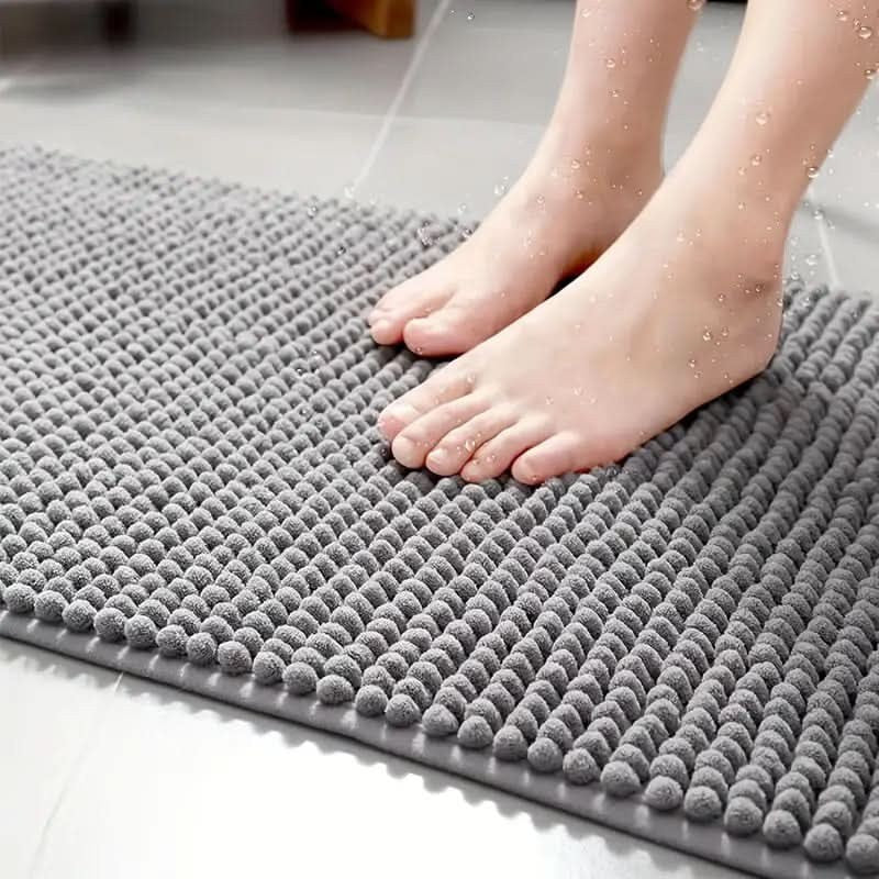 Chenille bath mat with a non-slip backing on a bathroom floor - product photo 5
