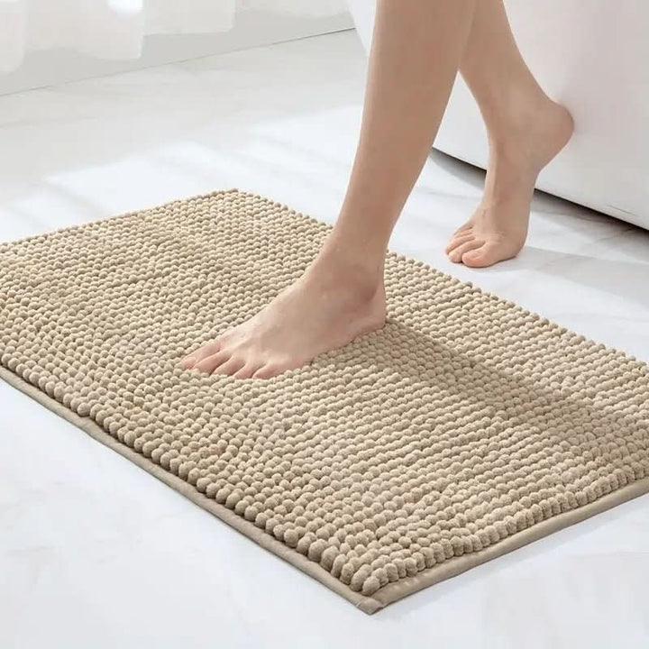 Chenille bath mat with a non-slip backing on a bathroom floor - product photo 8