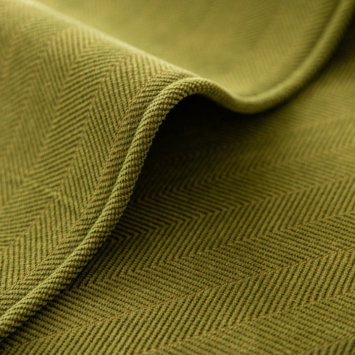 Chenille herringbone sofa cover on a couch - product photo 3