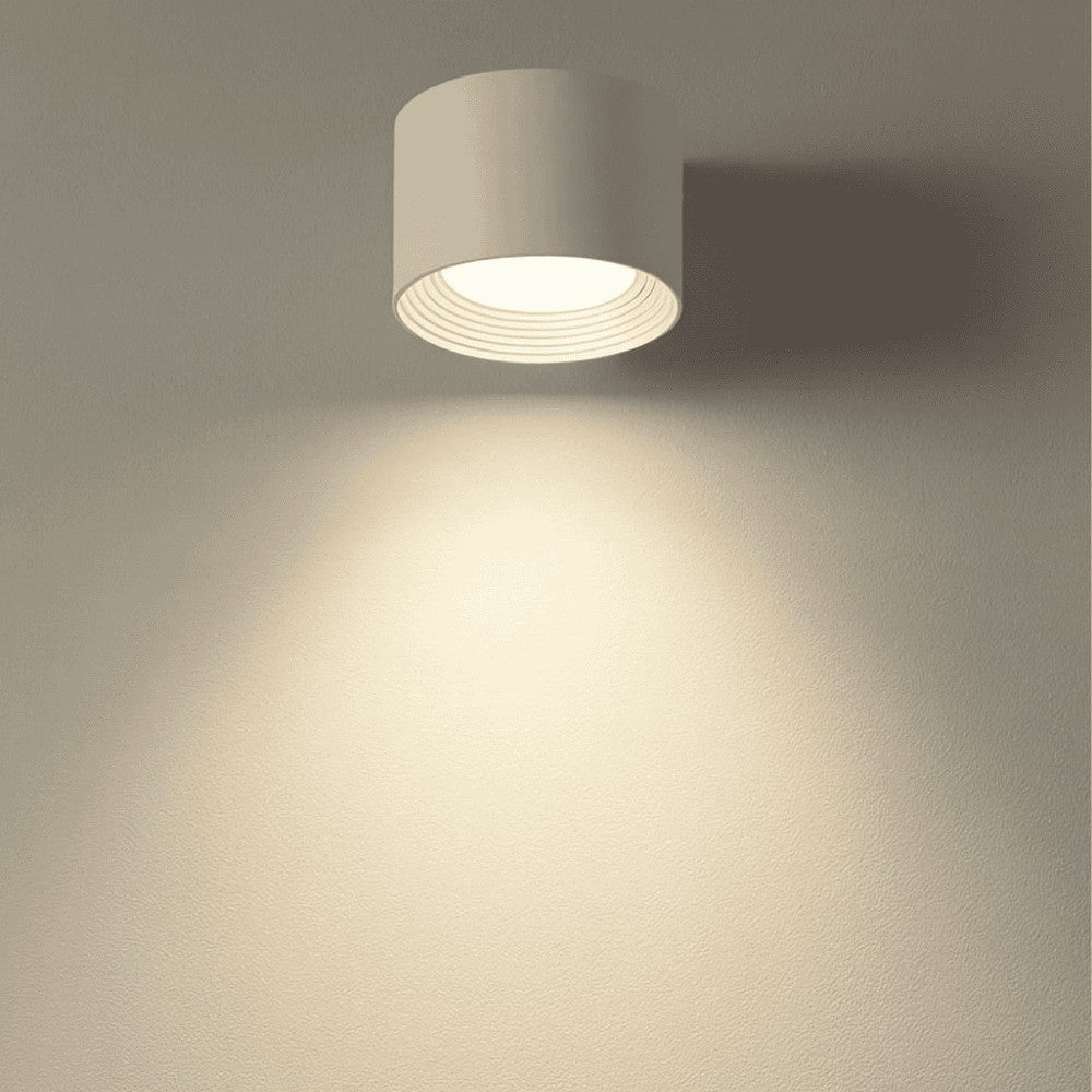 Cordless LED wall lamp casting a warm glow, controlled by remote - product photo 4