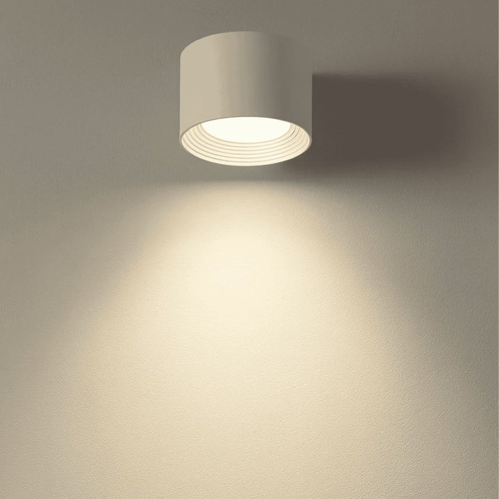 Cordless LED wall lamp casting a warm glow, controlled by remote - product photo 4