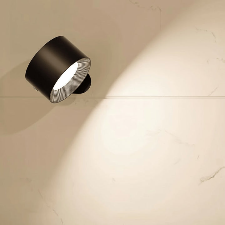 Cordless LED wall lamp casting a warm glow, controlled by remote - product photo 5
