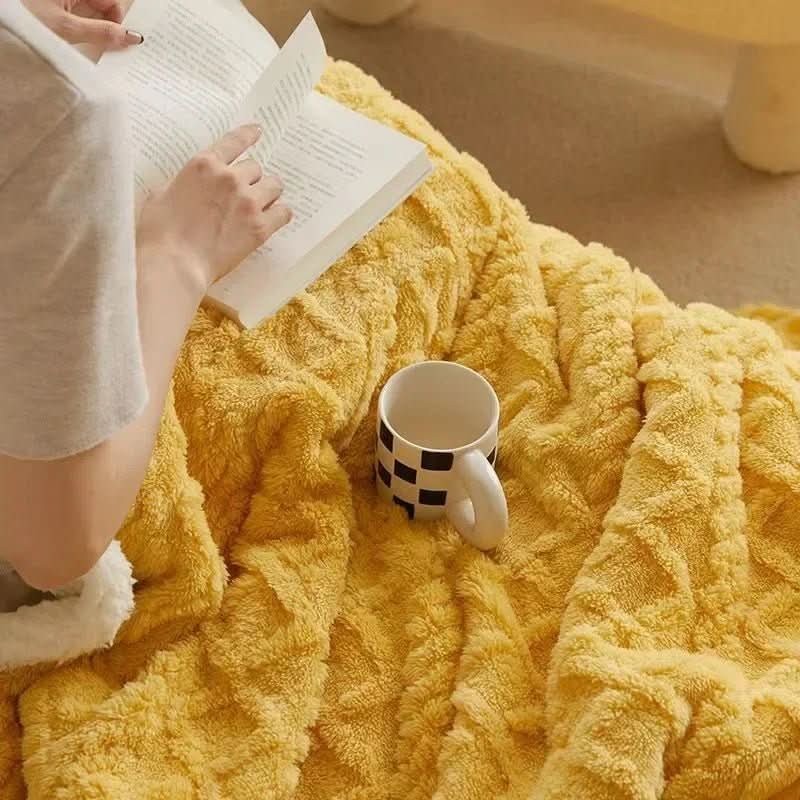 Double-sided sherpa and flannel blanket folded on a bed - product photo 3