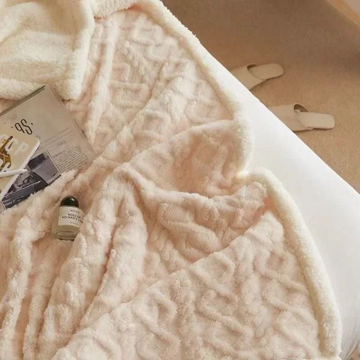 Double-sided sherpa and flannel blanket folded on a bed - product photo 6
