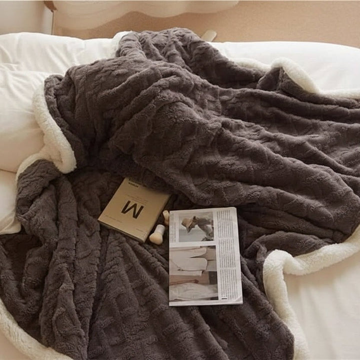 Double-sided sherpa and flannel blanket folded on a bed - product photo 7