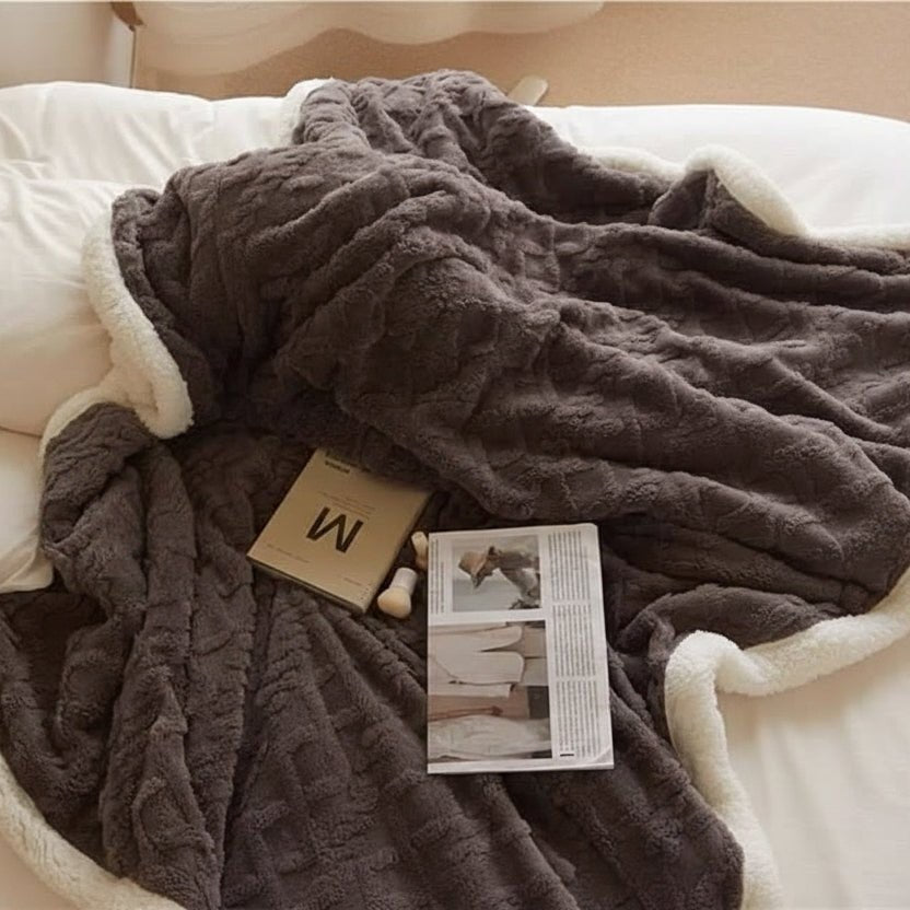 Double-sided sherpa and flannel blanket folded on a bed - product photo 8
