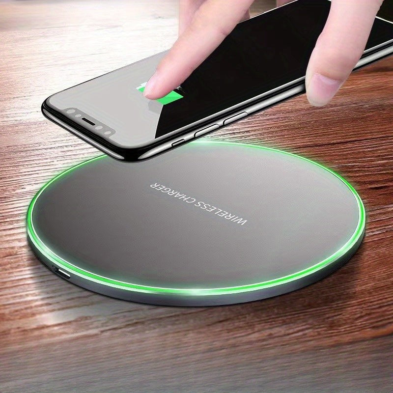 Wireless charging pad with a phone on it - product photo 1