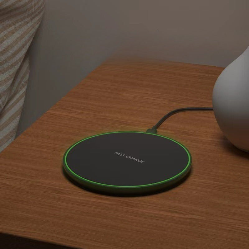 Wireless charging pad with a phone on it - product photo 5