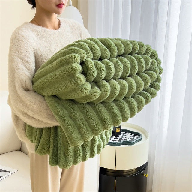 Faux fur throw blanket draped over a sofa - product photo 3