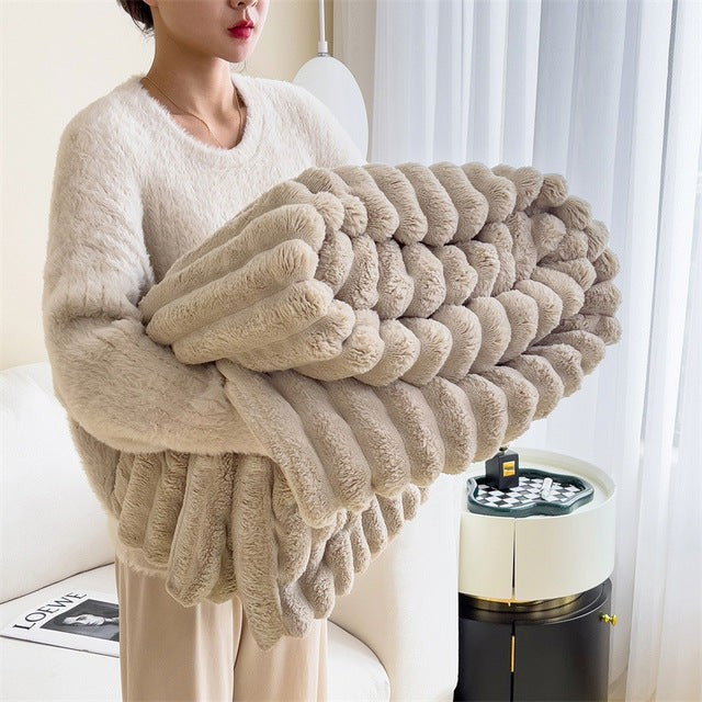 Faux fur throw blanket draped over a sofa - product photo 4