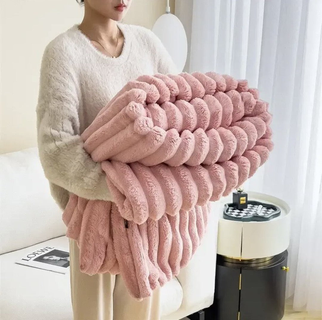 Faux fur throw blanket draped over a sofa - product photo 5