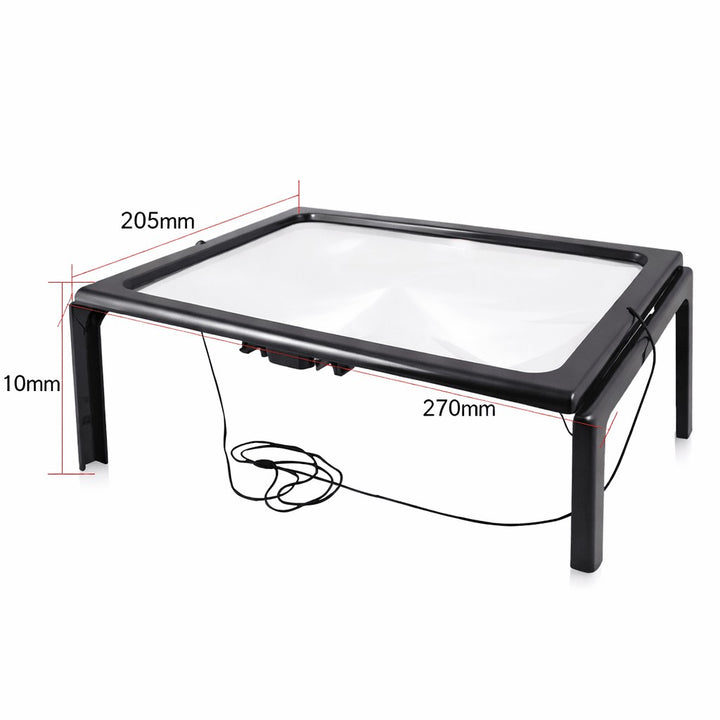 Foldable page magnifier with LED lighting standing over a book - product photo 4