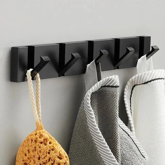 Foldable aluminum wall hooks folded flat against their rail - product photo 12