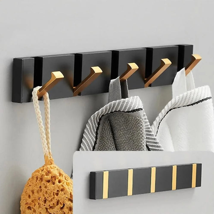 Foldable aluminum wall hooks folded flat against their rail - product photo 2