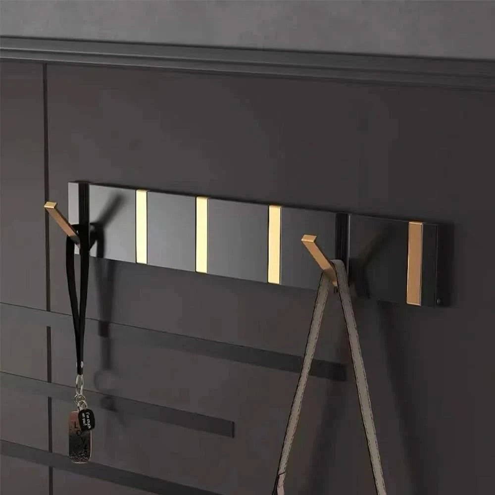 Foldable aluminum wall hooks folded flat against their rail - product photo 3