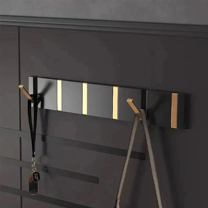 Foldable aluminum wall hooks folded flat against their rail - product photo 3