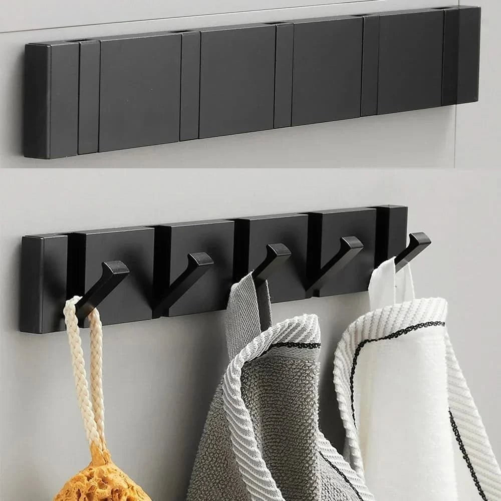 Foldable aluminum wall hooks folded flat against their rail - product photo 6