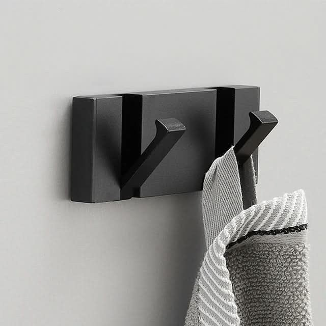 Foldable aluminum wall hooks folded flat against their rail - product photo 7