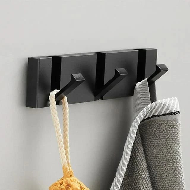 Foldable aluminum wall hooks folded flat against their rail - product photo 9