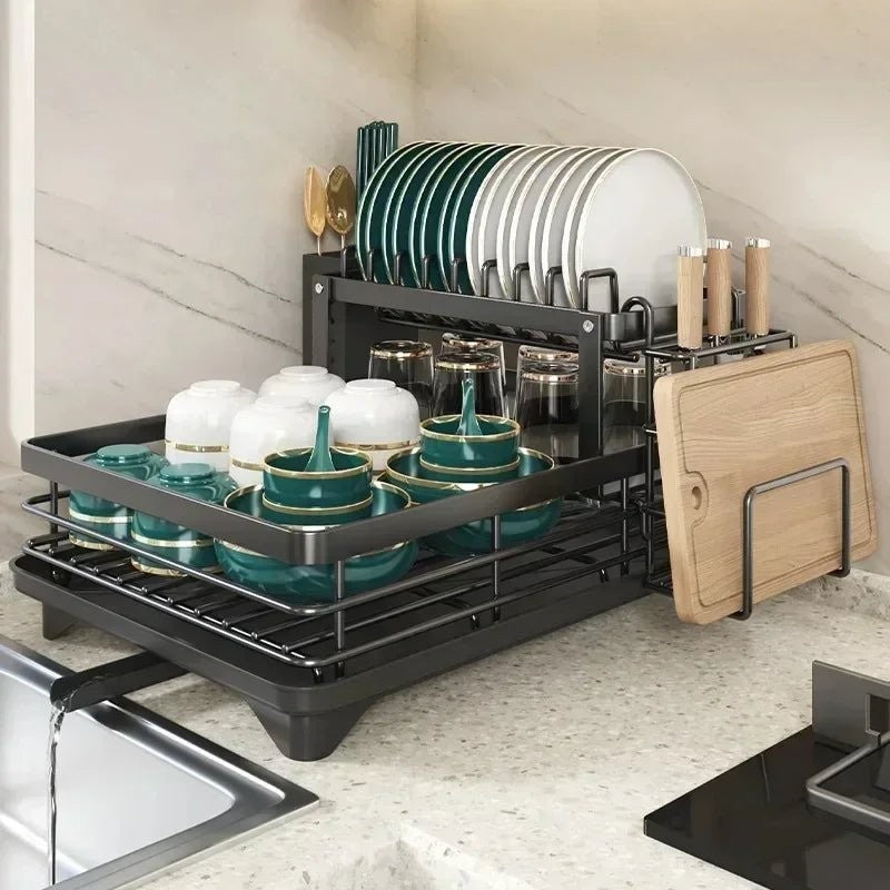Foldable stainless steel dish drying rack beside a sink - product photo 10