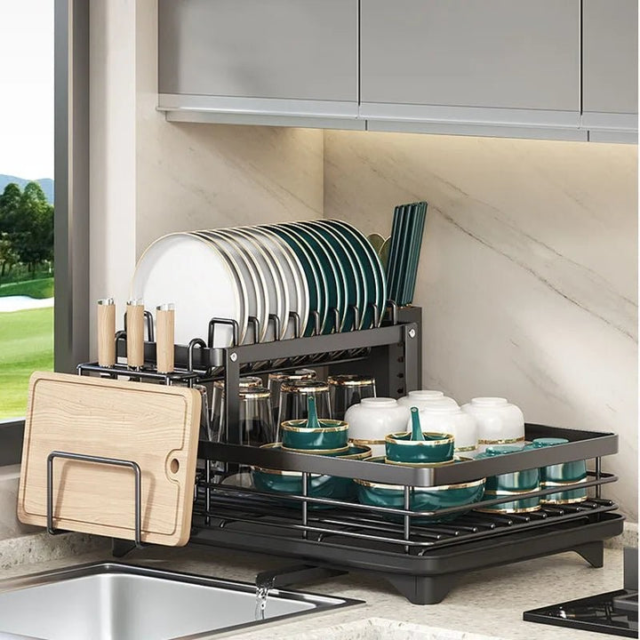 Foldable stainless steel dish drying rack beside a sink - product photo 8
