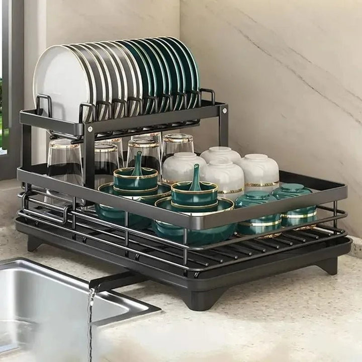 Foldable stainless steel dish drying rack beside a sink - product photo 9