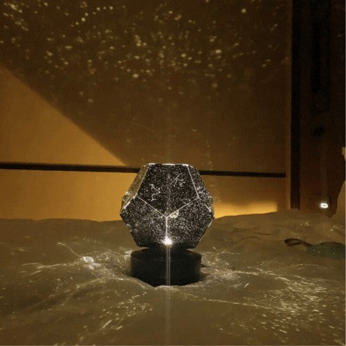 Galaxy projector casting stars across a ceiling - product photo 2