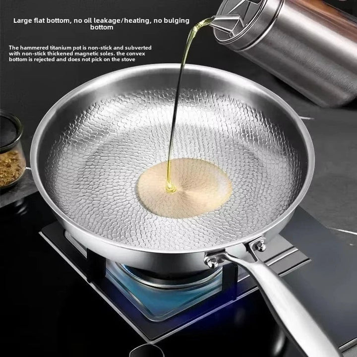 Hammered titanium-coated skillet on a hob - product photo 7