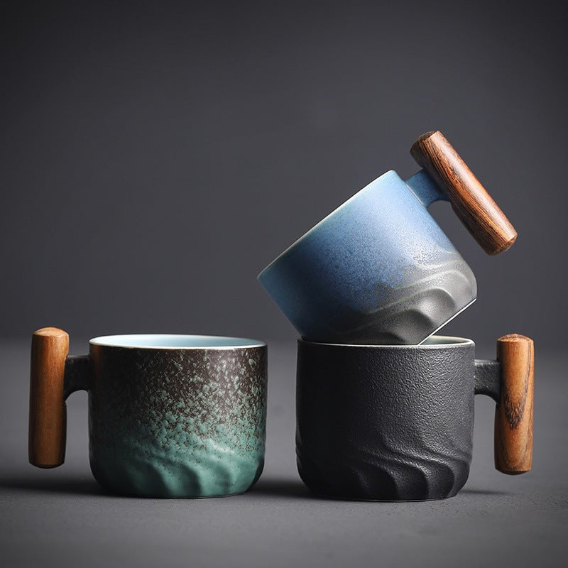 Handmade ceramic cup with a wooden handle - product photo 1