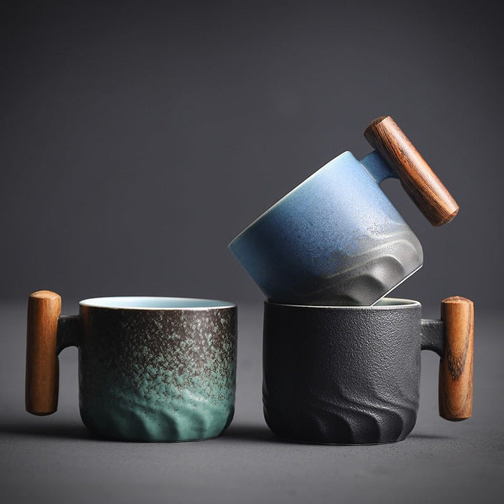 Handmade ceramic cup with a wooden handle - product photo 1