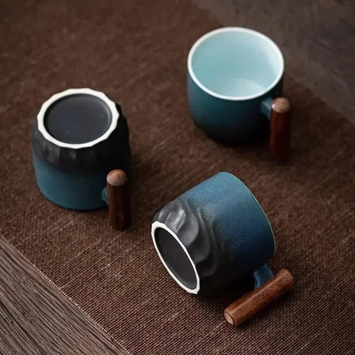 Handmade ceramic cup with a wooden handle - product photo 2