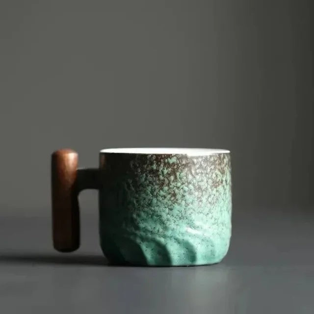 Handmade ceramic cup with a wooden handle - product photo 5