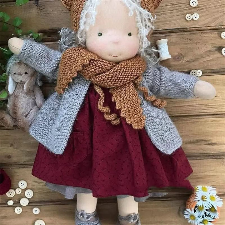 Handmade cotton Waldorf doll dressed in a knitted outfit - product photo 12