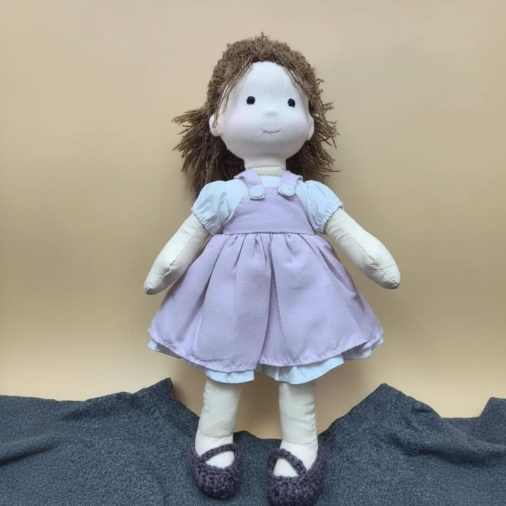 Handmade cotton Waldorf doll dressed in a knitted outfit - product photo 13