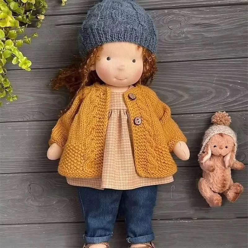 Handmade cotton Waldorf doll dressed in a knitted outfit - product photo 2