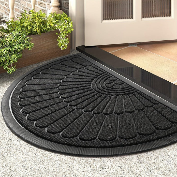 Half-round rubber doormat in front of a door - product photo 1