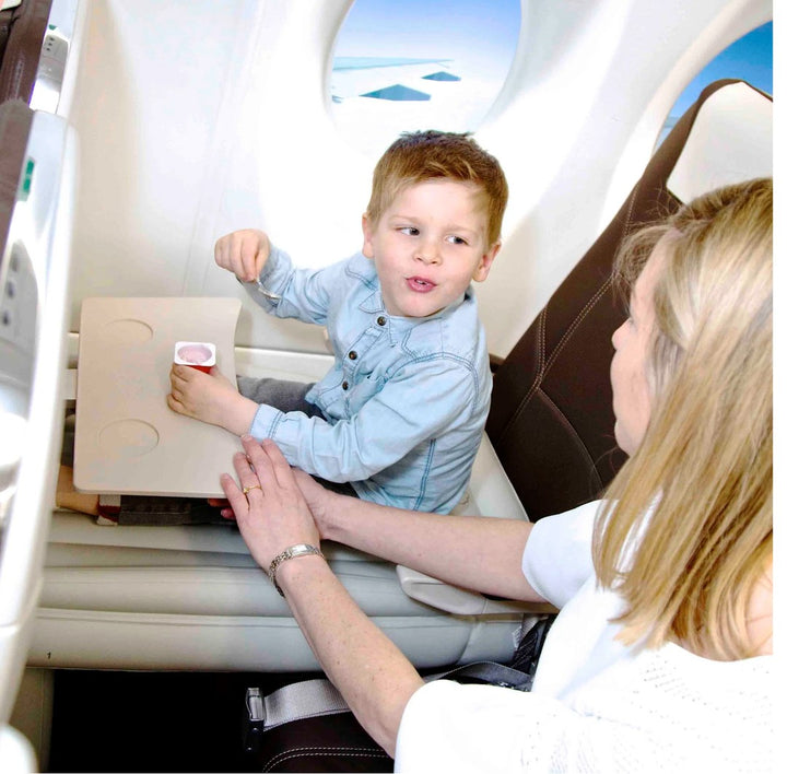 Inflatable airplane footrest bed set up in a seat - product photo 3