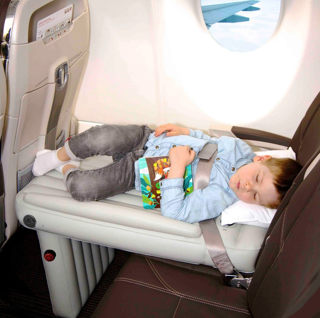 Inflatable airplane footrest bed set up in a seat - product photo 4