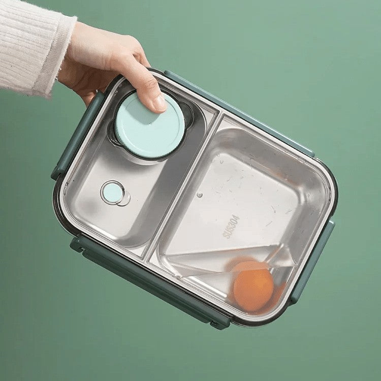 Insulated two-compartment lunch container holding a warm meal - product photo 2