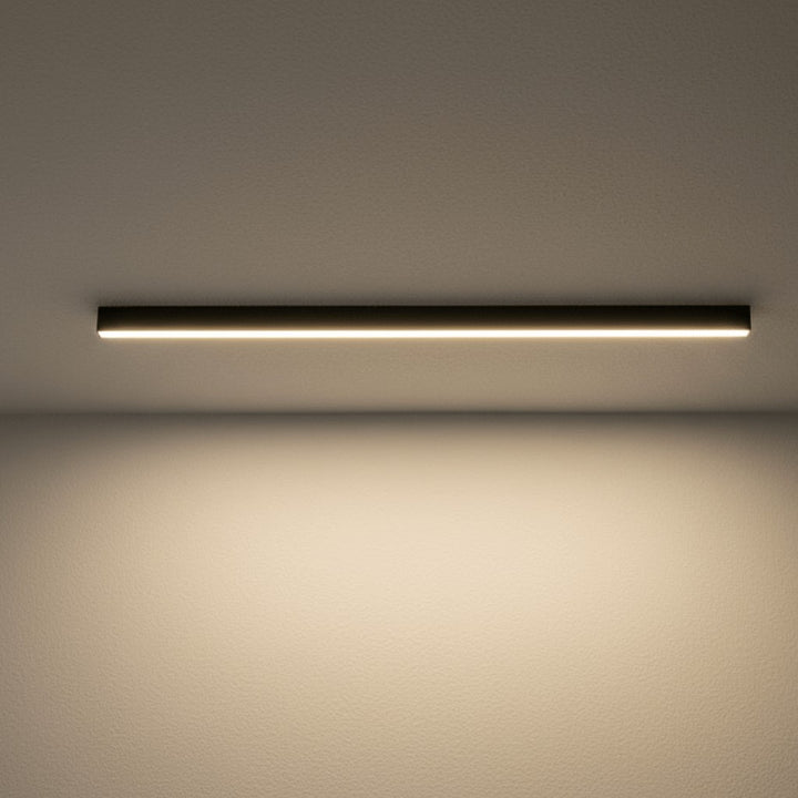 Minimalist linear LED ceiling bar lamp lighting a modern room - product photo 1
