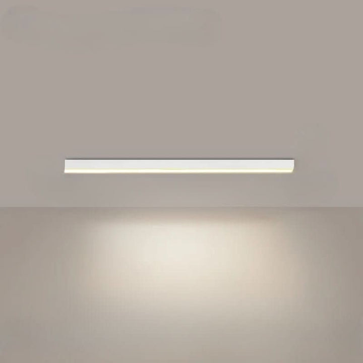 Minimalist linear LED ceiling bar lamp lighting a modern room - product photo 10