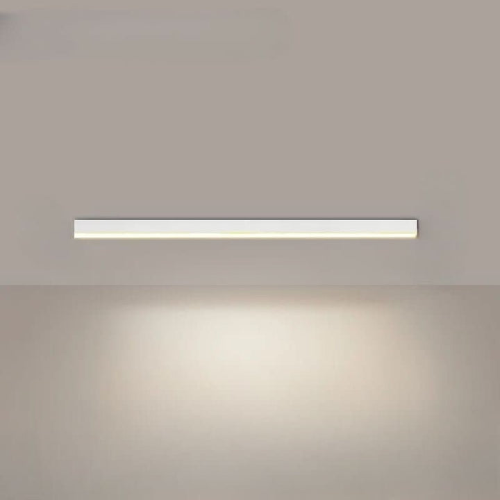 Minimalist linear LED ceiling bar lamp lighting a modern room - product photo 11