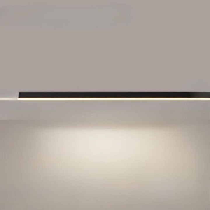 Minimalist linear LED ceiling bar lamp lighting a modern room - product photo 18