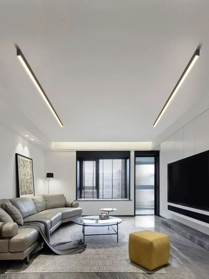 Minimalist linear LED ceiling bar lamp lighting a modern room - product photo 3