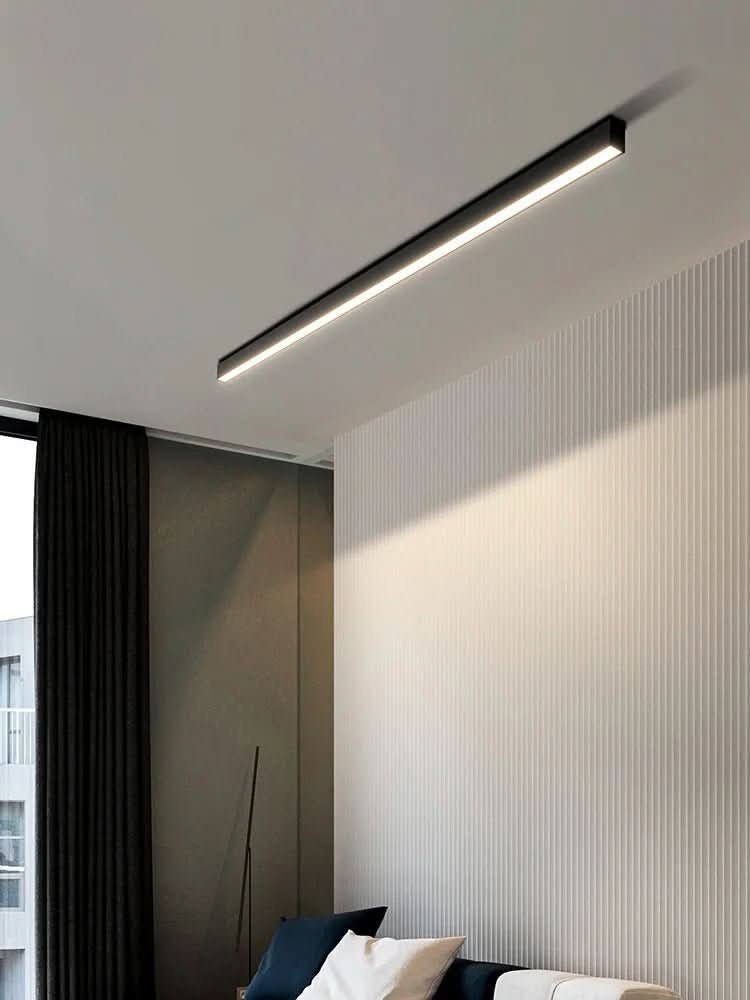 Minimalist linear LED ceiling bar lamp lighting a modern room - product photo 5