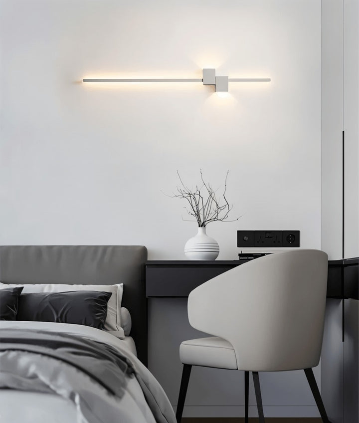 Minimalist linear LED wall light casting a soft glow along a wall - product photo 9